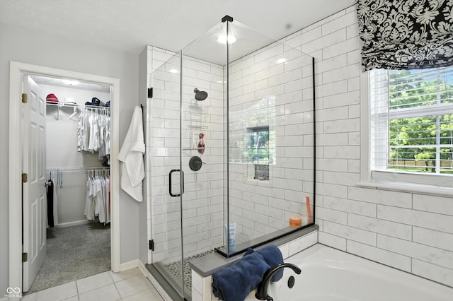 682 Shannon Ct, Noblesville, IN 46062 - full bathroom with a shower stall, tile patterned floors, a spacious closet, and a garden tub