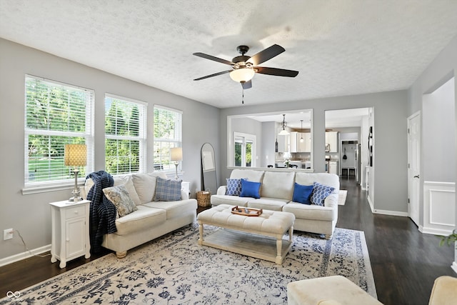 682 Shannon Ct, Noblesville, IN 46062 - living area with ceiling fan, dark wood-style flooring, and a textured ceiling