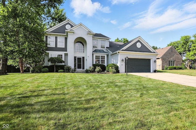 682 Shannon Ct, Noblesville, IN 46062 - view of front of property featuring driveway, an attached garage, a front lawn, stucco siding, and roof with shingles