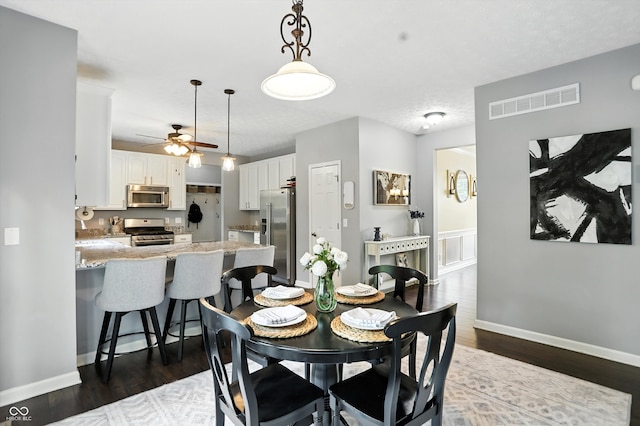 682 Shannon Ct, Noblesville, IN 46062 - dining space featuring ceiling fan and dark wood-style flooring