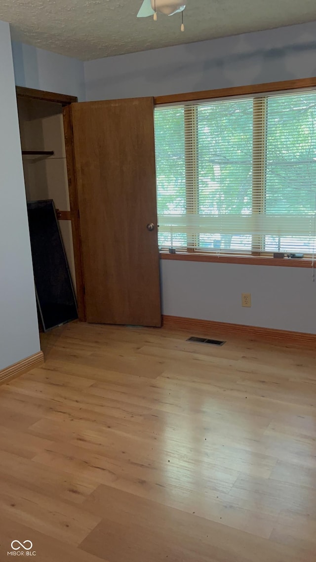7057 Bluffwood Ct, Brownsburg, IN 46112 - unfurnished bedroom featuring light wood-type flooring and baseboards
