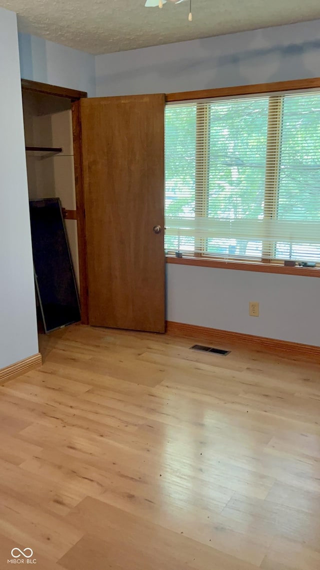 7057 Bluffwood Ct, Brownsburg, IN 46112 - unfurnished bedroom with light wood finished floors and baseboards