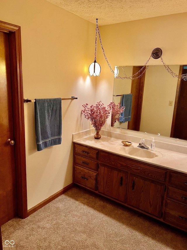 7057 Bluffwood Ct, Brownsburg, IN 46112 - bathroom with a textured ceiling, vanity, and carpet