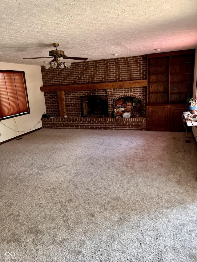7057 Bluffwood Ct, Brownsburg, IN 46112 - unfurnished living room with ceiling fan, a fireplace, a textured ceiling, and carpet floors