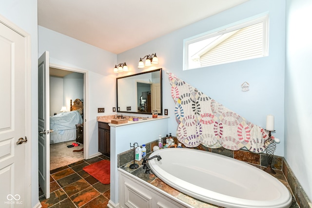 5119 Silverbell Dr, Plainfield, IN 46168 - ensuite bathroom featuring a garden tub, stone finish flooring, and vanity