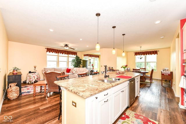 5119 Silverbell Dr, Plainfield, IN 46168 - kitchen with dark wood-style flooring, dishwasher, white cabinetry, decorative light fixtures, and a center island with sink