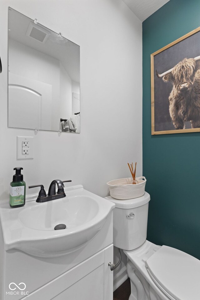 1830 Keller Ave, Columbus, IN 47201 - half bathroom featuring toilet and vanity
