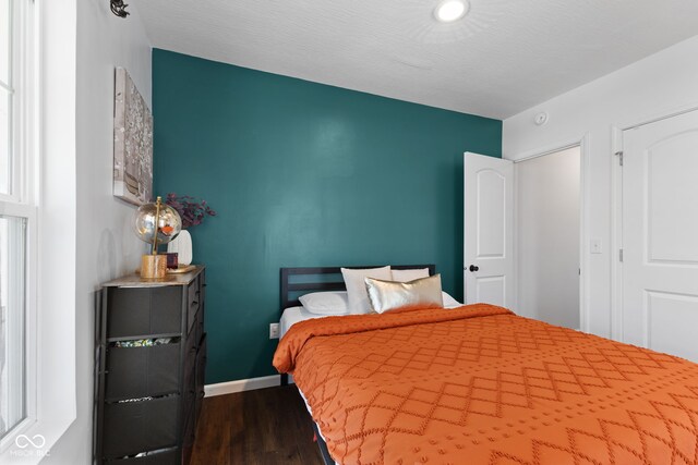 1830 Keller Ave, Columbus, IN 47201 - bedroom with dark wood finished floors and baseboards