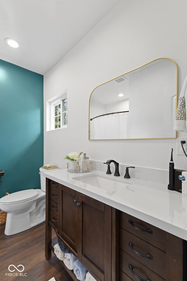 1830 Keller Ave, Columbus, IN 47201 - full bath with vanity, wood finished floors, and recessed lighting