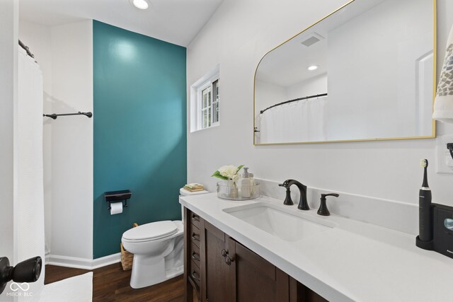 1830 Keller Ave, Columbus, IN 47201 - full bath with vanity, wood finished floors, and recessed lighting