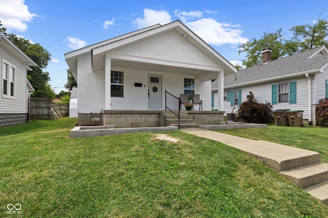 1830 Keller Ave, Columbus, IN 47201 - view of front facade featuring covered porch, a front yard, and a chimney