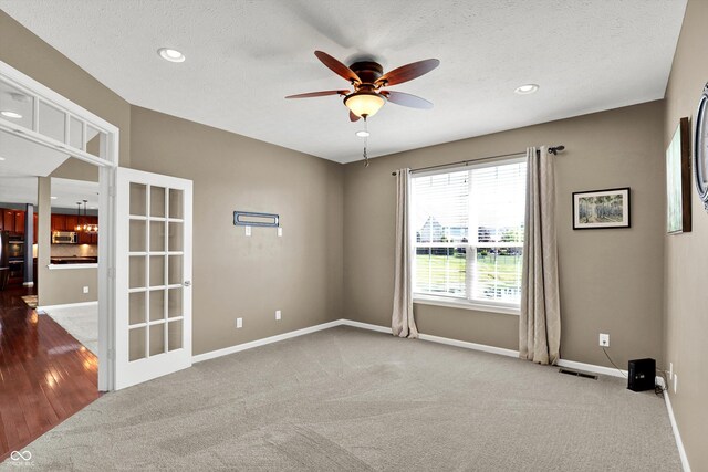 10267 Ranford Blvd, Fishers, IN 46040 - carpeted empty room featuring a ceiling fan, recessed lighting, and a textured ceiling