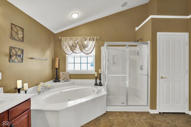 10267 Ranford Blvd, Fishers, IN 46040 - bathroom featuring vaulted ceiling, a shower stall, a jetted tub, vanity, and tile patterned flooring