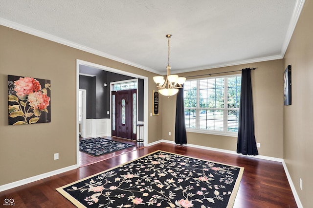 10267 Ranford Blvd, Fishers, IN 46040 - entryway featuring wood finished floors, ornamental molding, and a chandelier