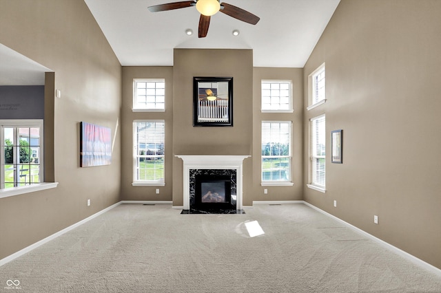 10267 Ranford Blvd, Fishers, IN 46040 - unfurnished living room with a high ceiling, ceiling fan, carpet, and a fireplace