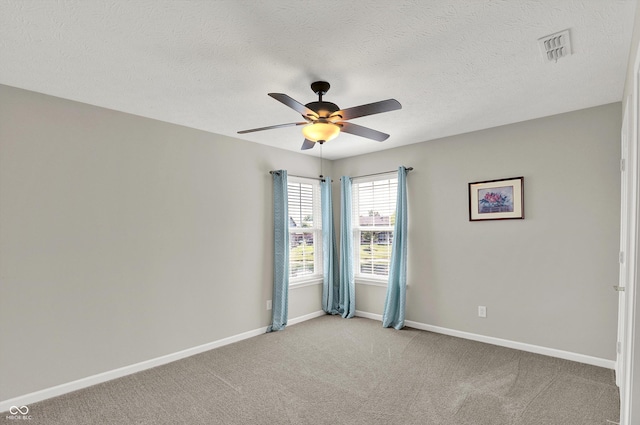 10267 Ranford Blvd, Fishers, IN 46040 - spare room featuring ceiling fan, light carpet, and a textured ceiling