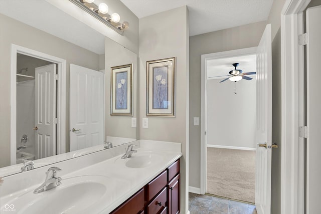 10267 Ranford Blvd, Fishers, IN 46040 - full bathroom featuring double vanity, a ceiling fan, and washtub / shower combination