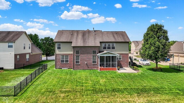 10267 Ranford Blvd, Fishers, IN 46040 - back of property featuring brick siding, a sunroom, and a fenced backyard