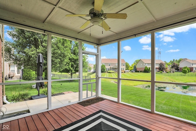 10267 Ranford Blvd, Fishers, IN 46040 - unfurnished sunroom with a ceiling fan, a residential view, a water view, and healthy amount of natural light
