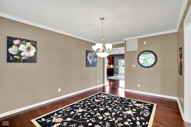 10267 Ranford Blvd, Fishers, IN 46040 - dining area featuring dark wood-style floors, a chandelier, and ornamental molding