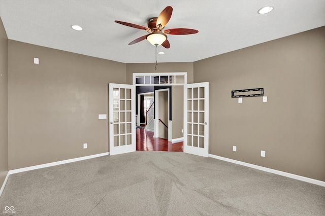 10267 Ranford Blvd, Fishers, IN 46040 - carpeted spare room with french doors, a ceiling fan, and recessed lighting