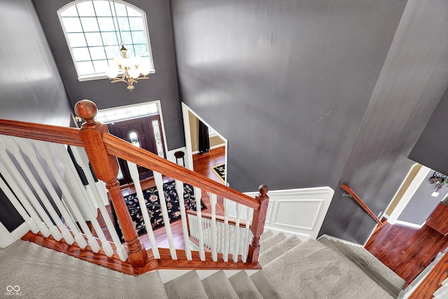 10267 Ranford Blvd, Fishers, IN 46040 - stairs featuring a chandelier and carpet flooring
