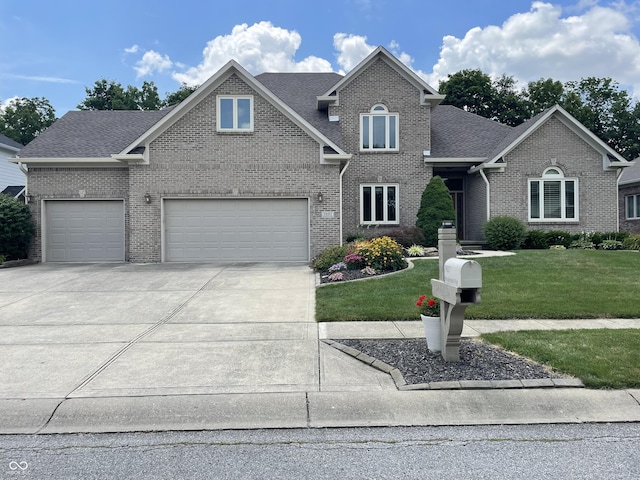 7927 Broadmead Way, Indianapolis, IN 46259 - traditional-style house with concrete driveway, brick siding, and a front yard