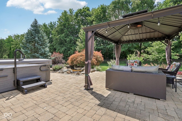 7927 Broadmead Way, Indianapolis, IN 46259 - view of patio / terrace featuring a hot tub, a gazebo, an outdoor hangout area, and view of wooded area