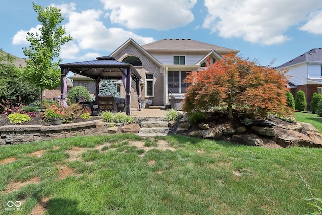 7927 Broadmead Way, Indianapolis, IN 46259 - view of front of property featuring a gazebo, a patio, brick siding, and a front yard