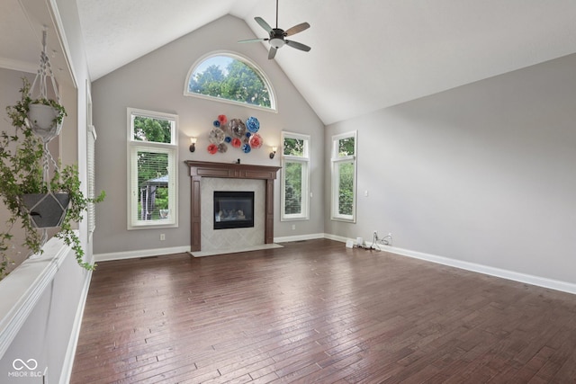 7927 Broadmead Way, Indianapolis, IN 46259 - unfurnished living room with ceiling fan, high vaulted ceiling, a tiled fireplace, and dark wood-style floors