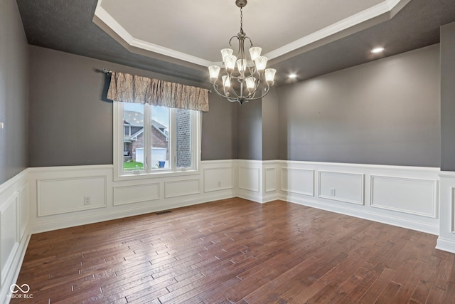 7927 Broadmead Way, Indianapolis, IN 46259 - unfurnished room with a raised ceiling, a chandelier, crown molding, dark wood finished floors, and wainscoting