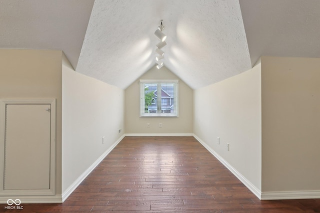 7927 Broadmead Way, Indianapolis, IN 46259 - bonus room featuring hardwood / wood-style floors, a textured ceiling, and lofted ceiling
