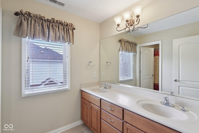 7927 Broadmead Way, Indianapolis, IN 46259 - bathroom featuring double vanity, a chandelier, and tile patterned flooring
