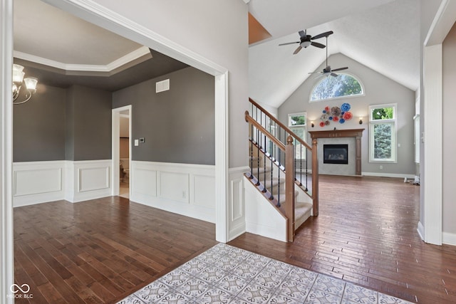 7927 Broadmead Way, Indianapolis, IN 46259 - entrance foyer featuring stairs, a ceiling fan, wood-type flooring, vaulted ceiling, and wainscoting