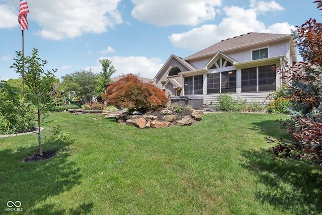 7927 Broadmead Way, Indianapolis, IN 46259 - back of property featuring a sunroom and a lawn