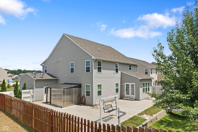 2833 Holiday Way, Greenwood, IN 46143 - rear view of house with a patio, a fenced backyard, and a shingled roof
