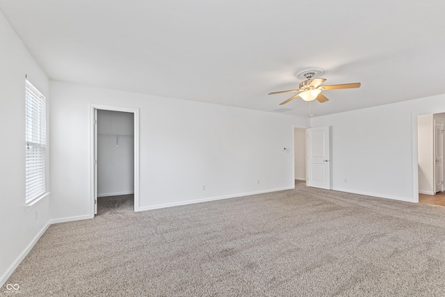 2833 Holiday Way, Greenwood, IN 46143 - unfurnished bedroom with carpet flooring, ceiling fan, and a spacious closet