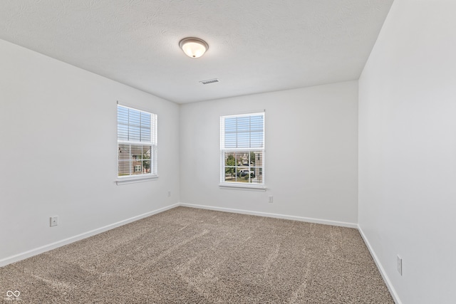2833 Holiday Way, Greenwood, IN 46143 - carpeted spare room featuring baseboards and a textured ceiling