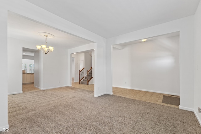2833 Holiday Way, Greenwood, IN 46143 - empty room with light colored carpet, a chandelier, and stairs