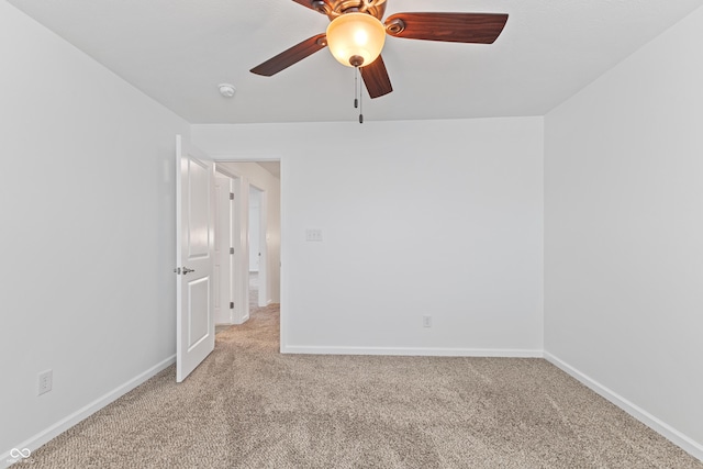 2833 Holiday Way, Greenwood, IN 46143 - empty room featuring light carpet, a ceiling fan, and a smoke detector