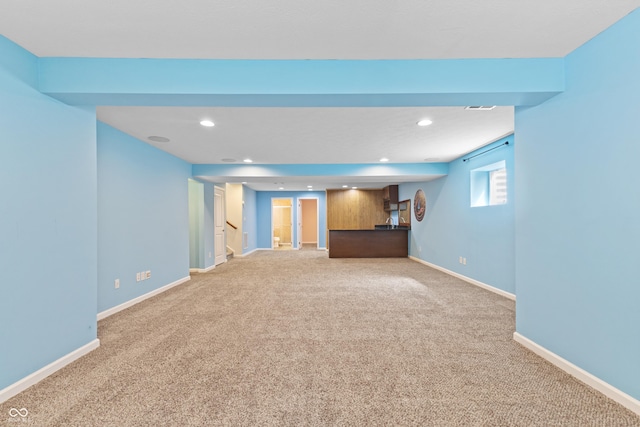 2833 Holiday Way, Greenwood, IN 46143 - below grade area featuring light carpet, recessed lighting, and stairs