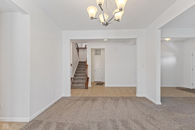 2833 Holiday Way, Greenwood, IN 46143 - entrance foyer with light carpet, stairway, and a chandelier