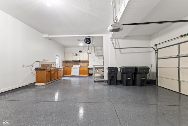 2833 Holiday Way, Greenwood, IN 46143 - garage featuring a garage door opener and a sink