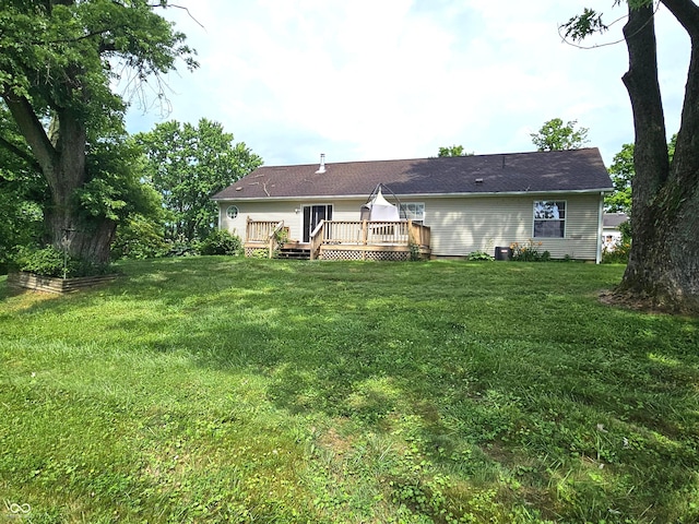 7422 S 575 W, Morgantown, IN 46160 - rear view of house featuring a wooden deck and a lawn