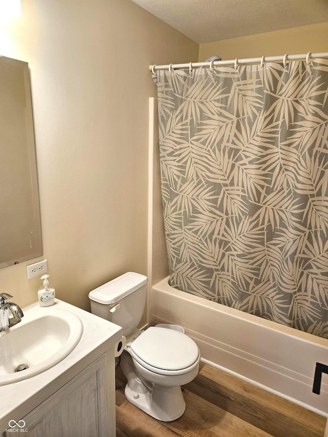 7422 S 575 W, Morgantown, IN 46160 - bathroom featuring shower / tub combo with curtain, wood finished floors, vanity, and a textured ceiling