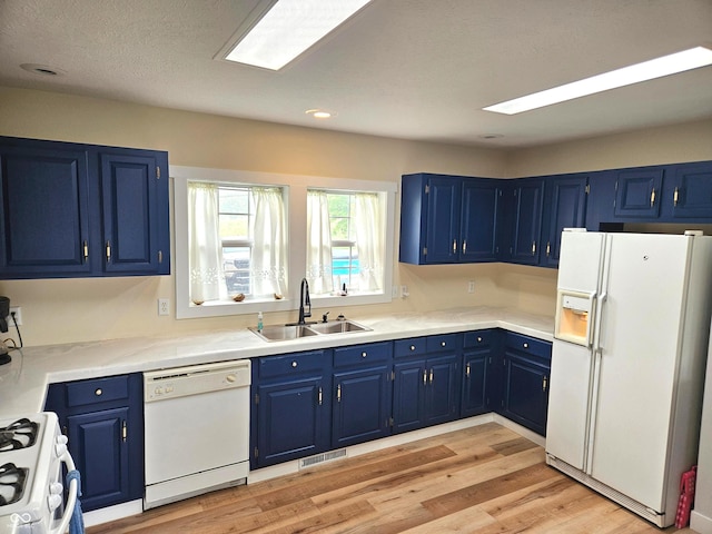 7422 S 575 W, Morgantown, IN 46160 - kitchen with white appliances, blue cabinetry, light wood-style floors, light countertops, and recessed lighting