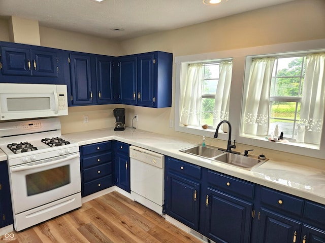7422 S 575 W, Morgantown, IN 46160 - kitchen with white appliances, blue cabinets, plenty of natural light, light wood-style floors, and recessed lighting