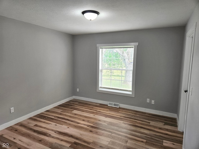 7422 S 575 W, Morgantown, IN 46160 - empty room featuring dark wood-style flooring and a textured ceiling