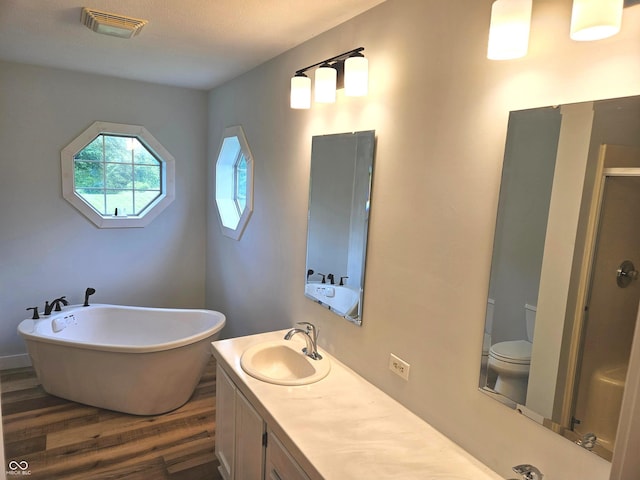 7422 S 575 W, Morgantown, IN 46160 - full bath featuring wood finished floors, a shower stall, a soaking tub, and double vanity