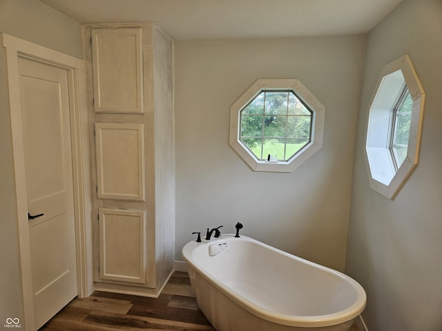 7422 S 575 W, Morgantown, IN 46160 - bathroom featuring a freestanding tub and wood finished floors